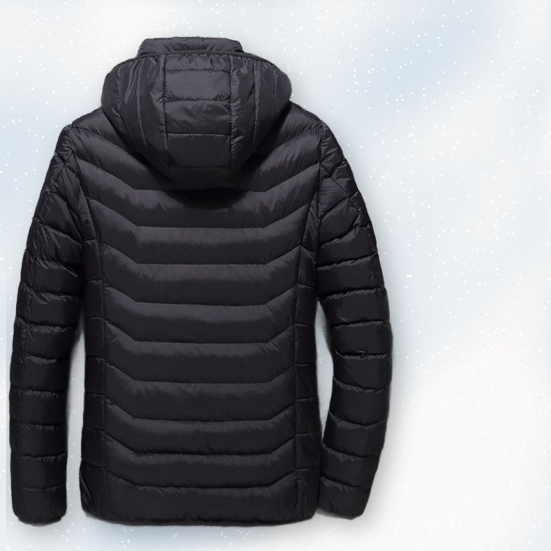Back view of the black USB heated jacket on fresh snow